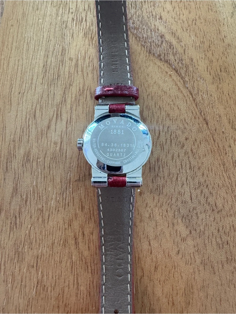 VZO Movado Ladies Watch w/ Diamond Bezel. Red leather strap. Pristine condition.